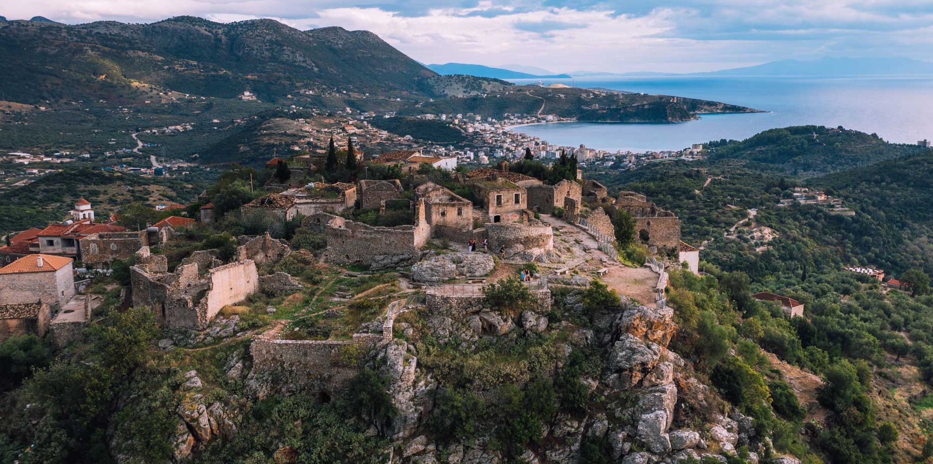 Himara Castle ruins on the hilltop above Himara town and the Ionian coast.