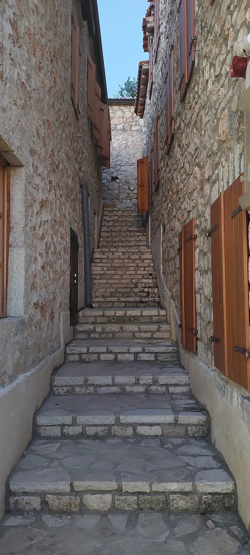 Stone alley in the old village of Dhërmi above the Ionian coast.