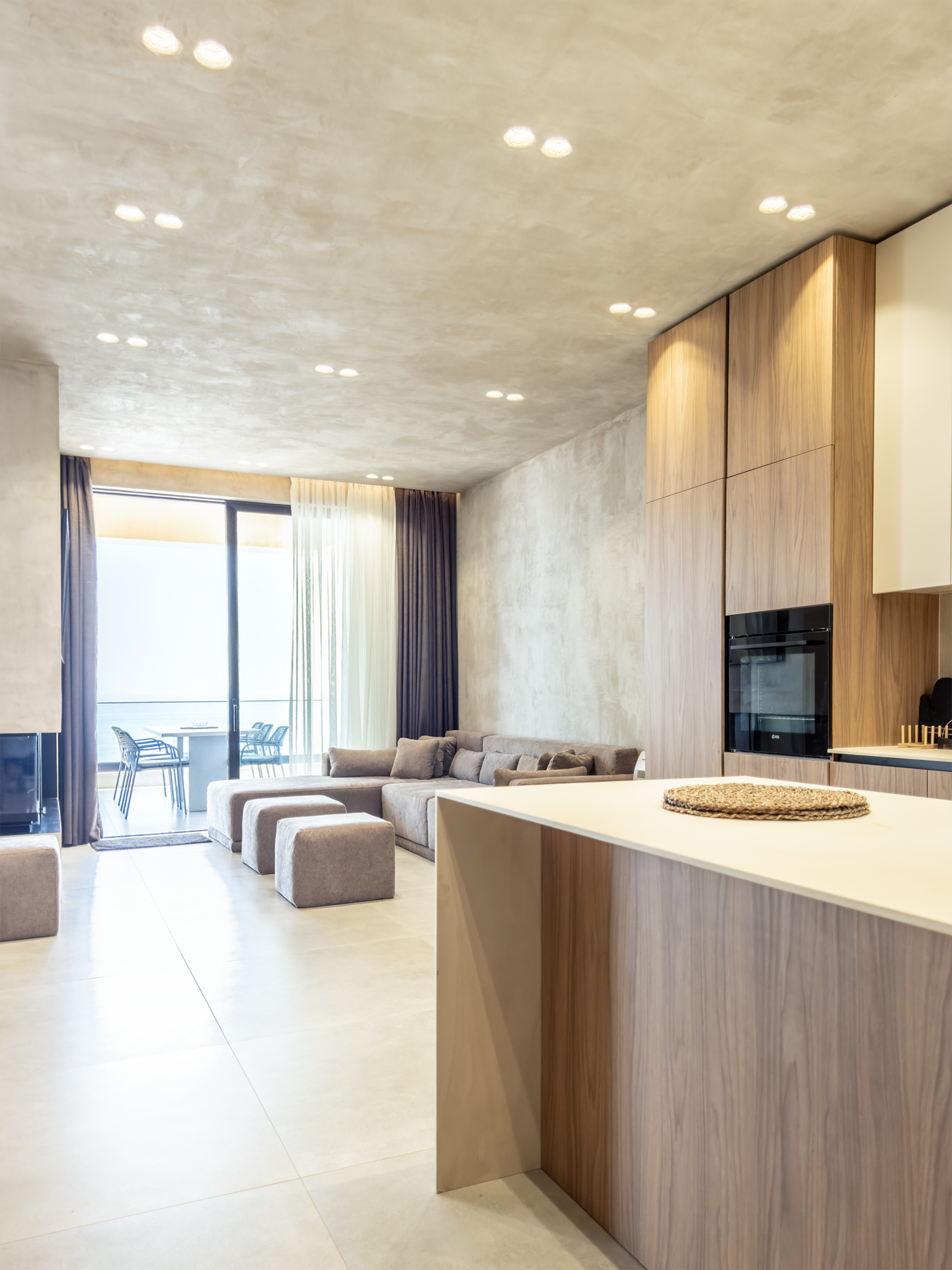 Living room at Villa 4 with fireplace and Ionian sea views.