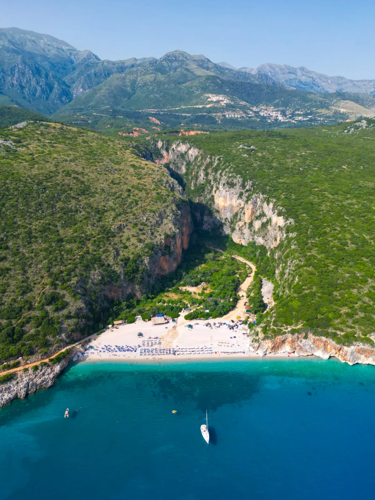 Gjipe Beach — a hidden cove at the foot of a limestone canyon on the Albanian Riviera.