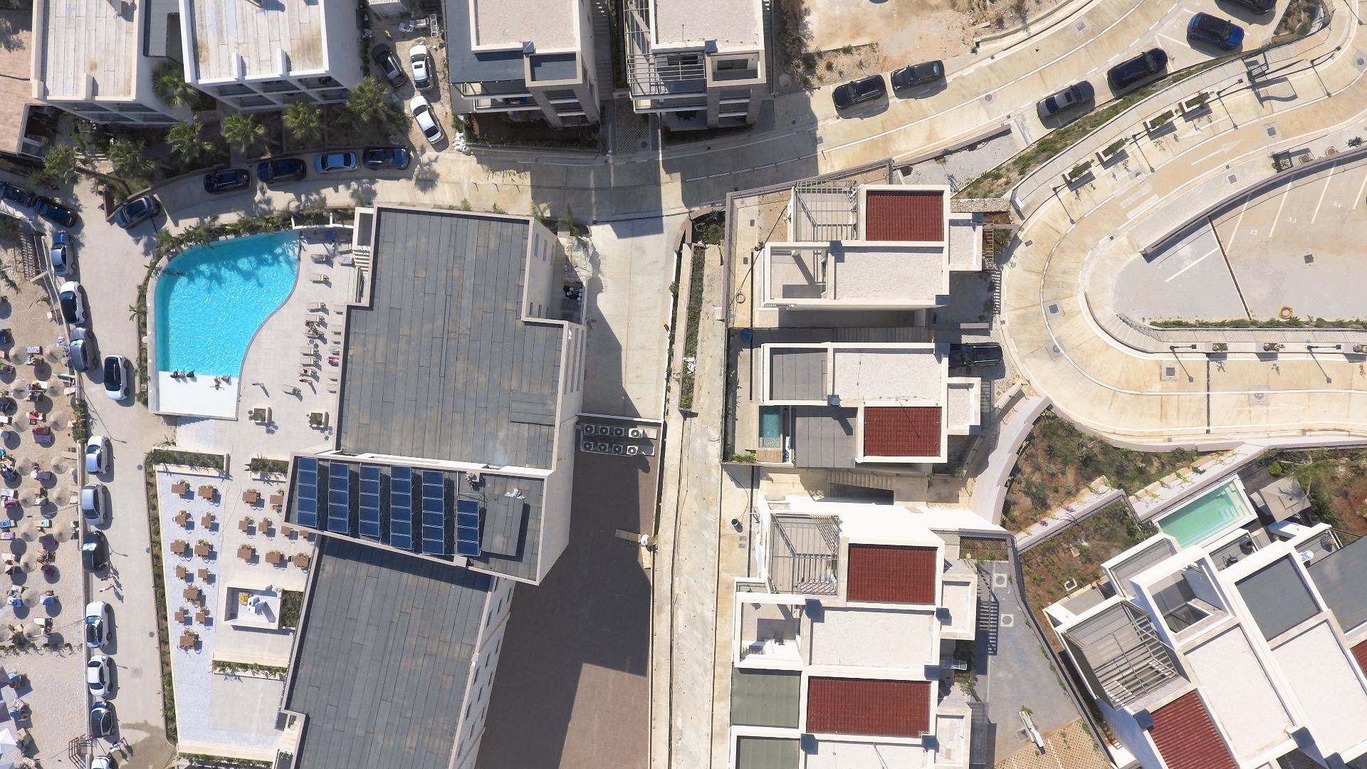 Wide aerial of the bay below Villa 4, looking out across the Ionian.