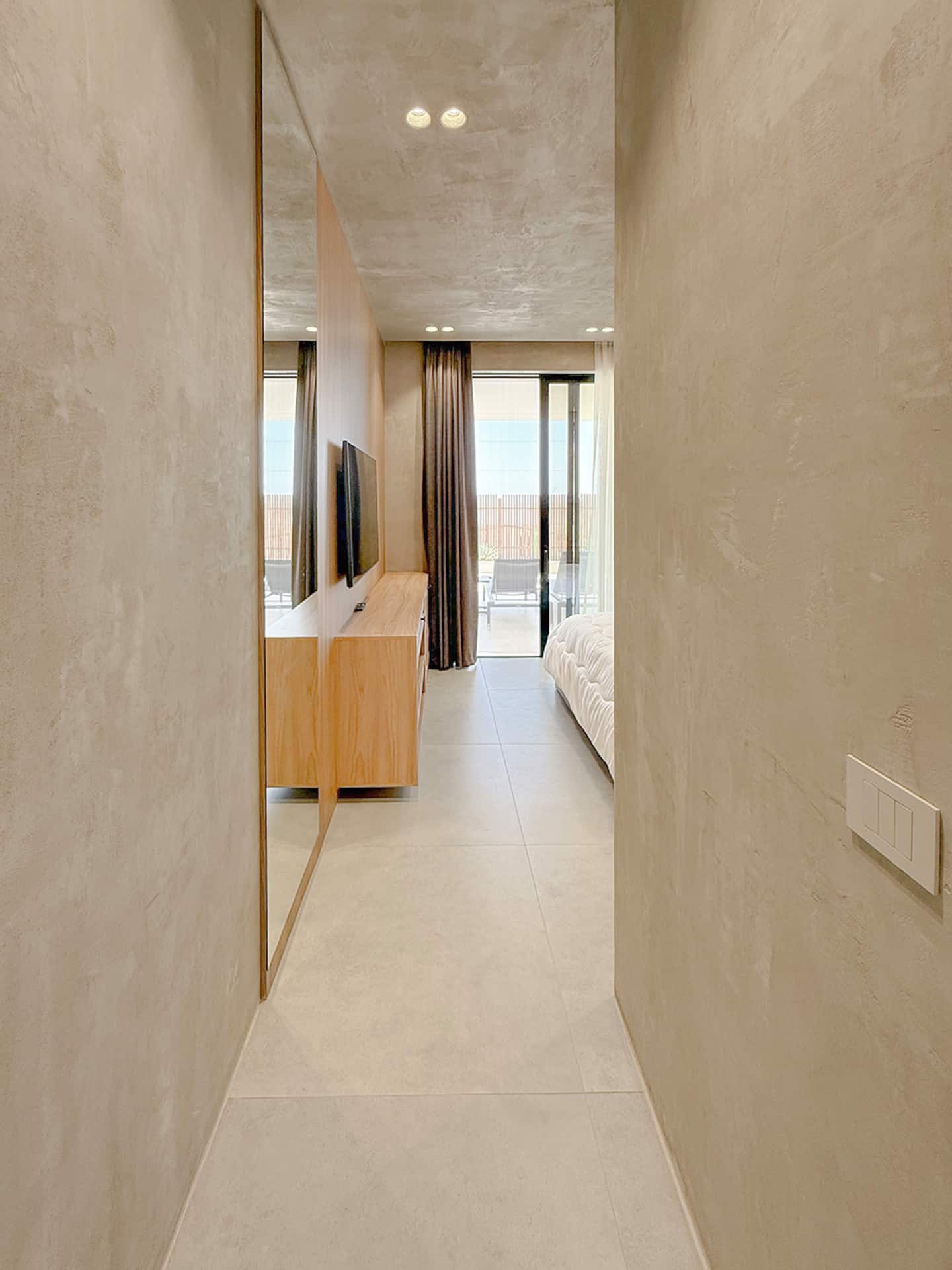Bedroom 1 at Villa 4 — king bed and terrace access.