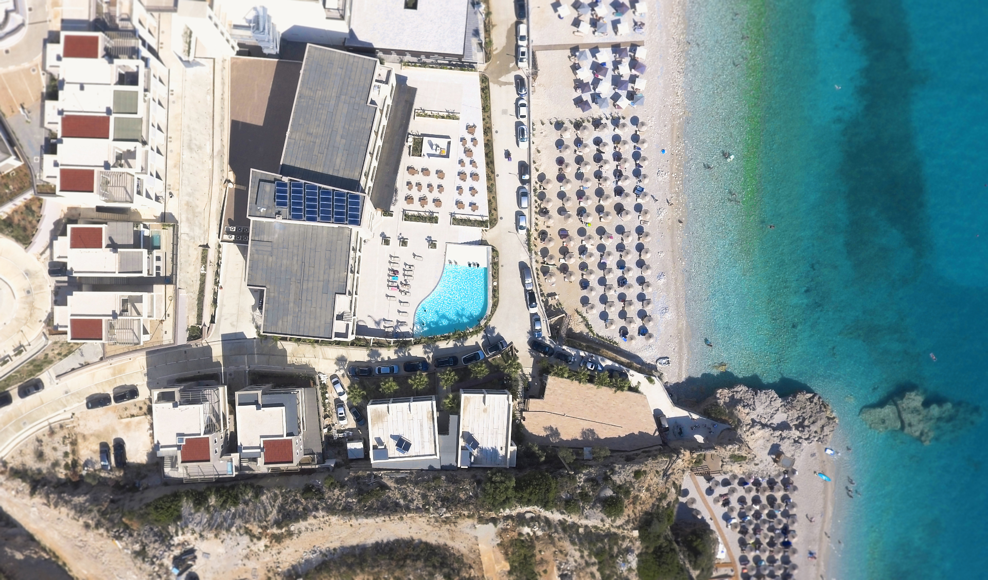 Aerial view of Villa 4 at Thymus Resort, with the plunge pool and Drymadhes Beach just steps away.