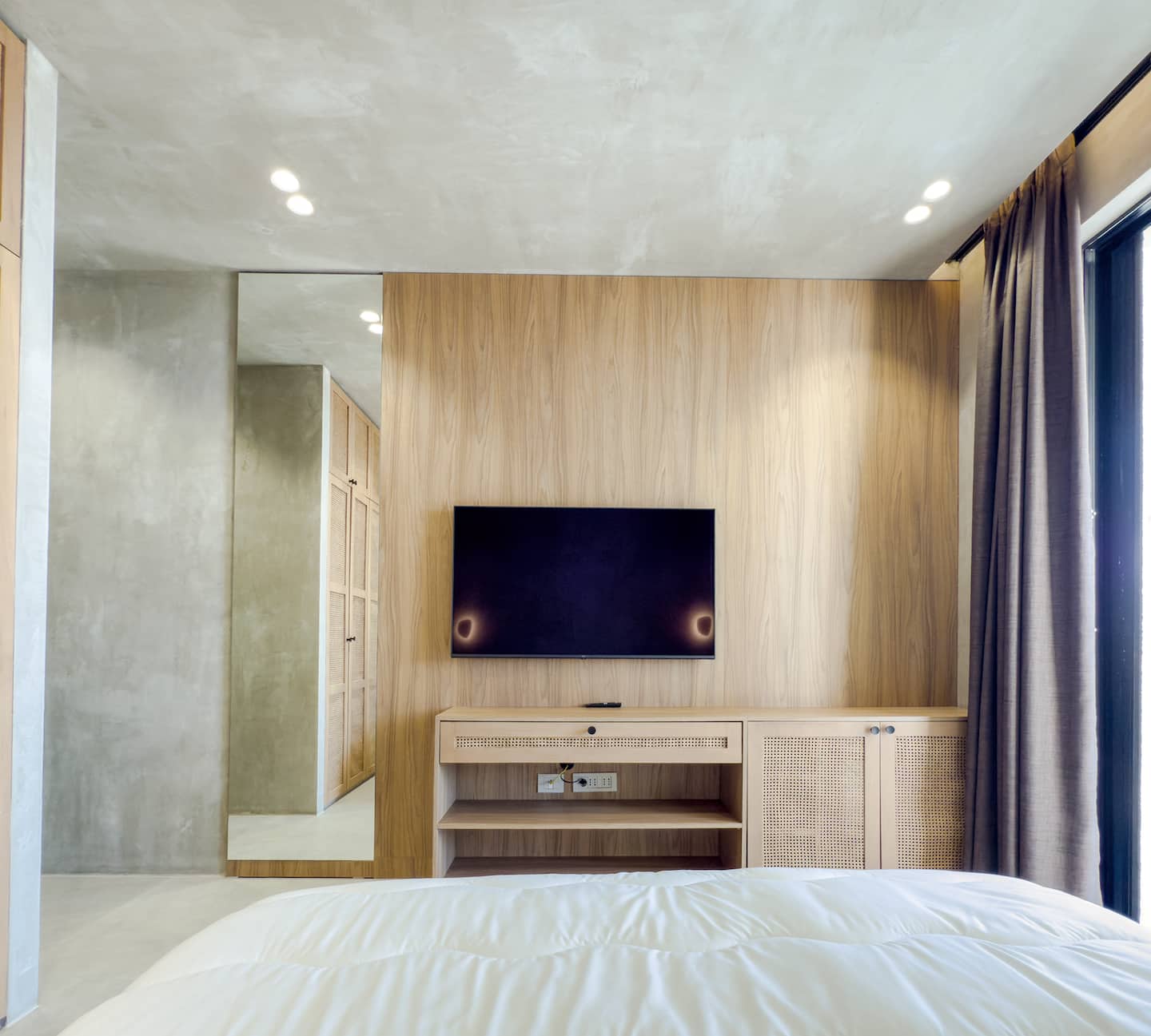 Bedroom 1 at Villa 4 — king bed and terrace access.