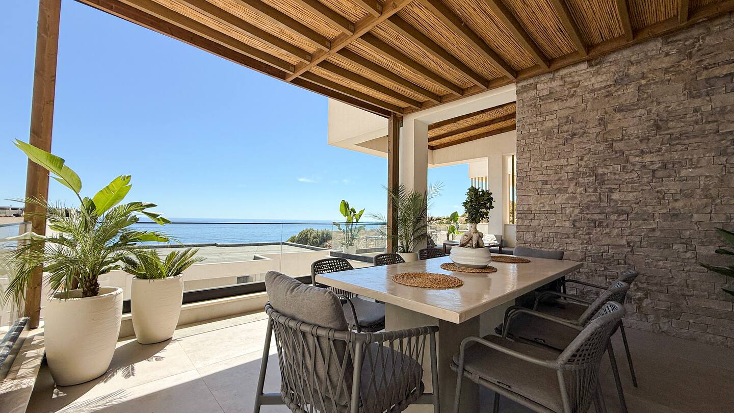 Shaded terrace at Villa 4 with sea views over Drymadhes.
