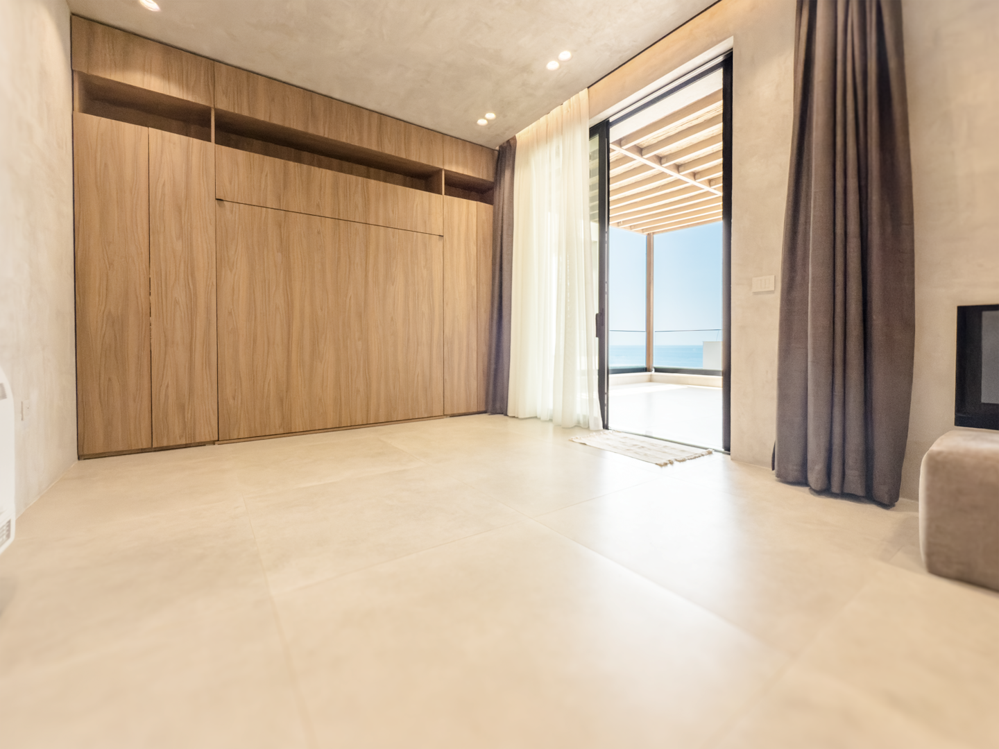 Bedroom 3 at Villa 4 — open-plan room adjacent to the living area.