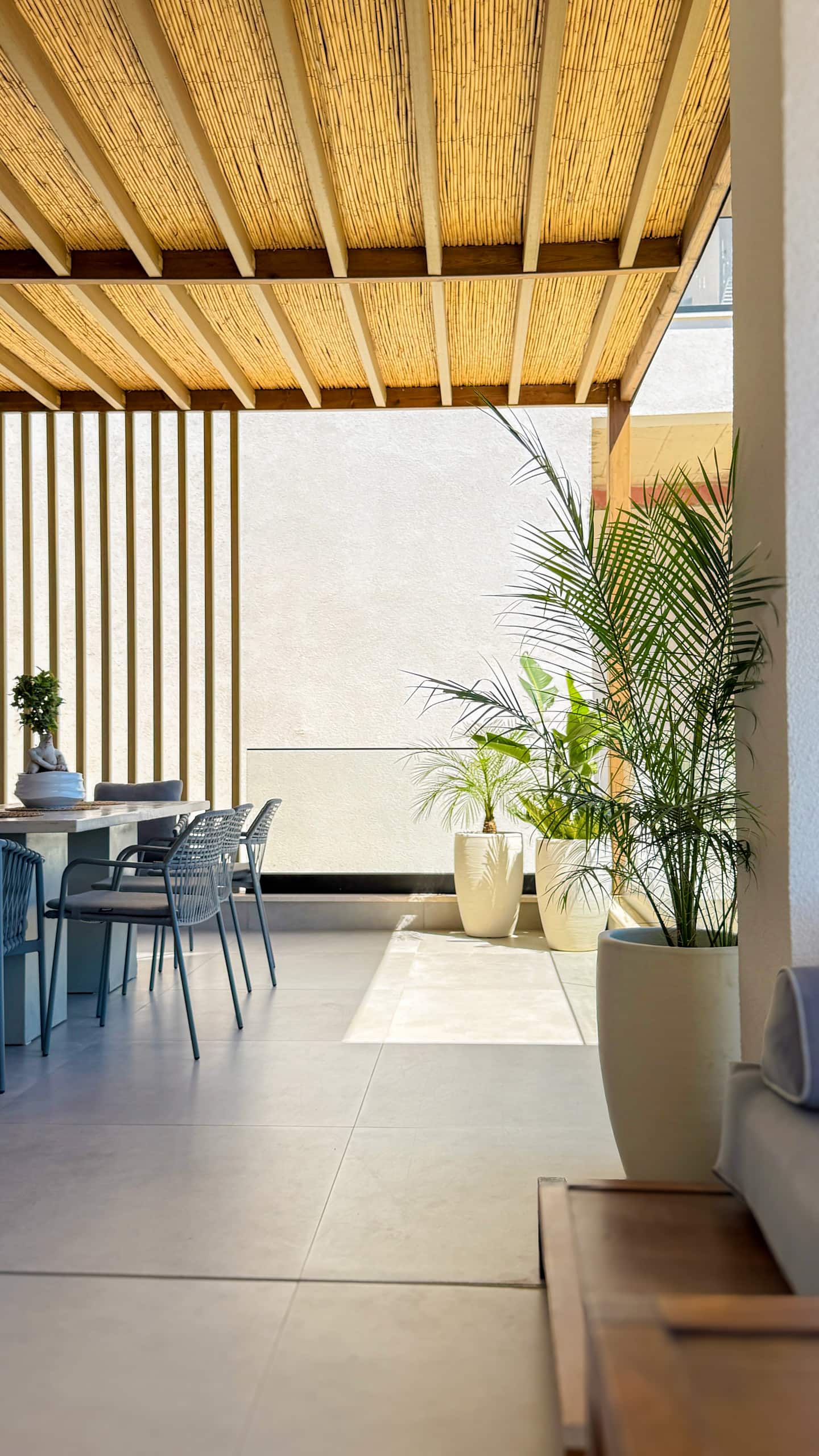Shaded terrace at Villa 4 with sea views over Drymadhes.