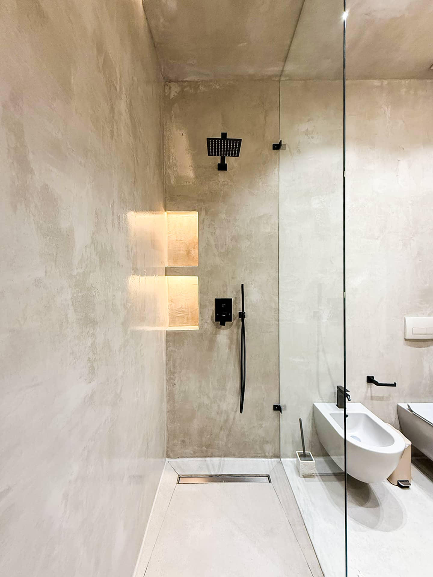 Full bathroom at Villa 4 — double sink and warm oak joinery.