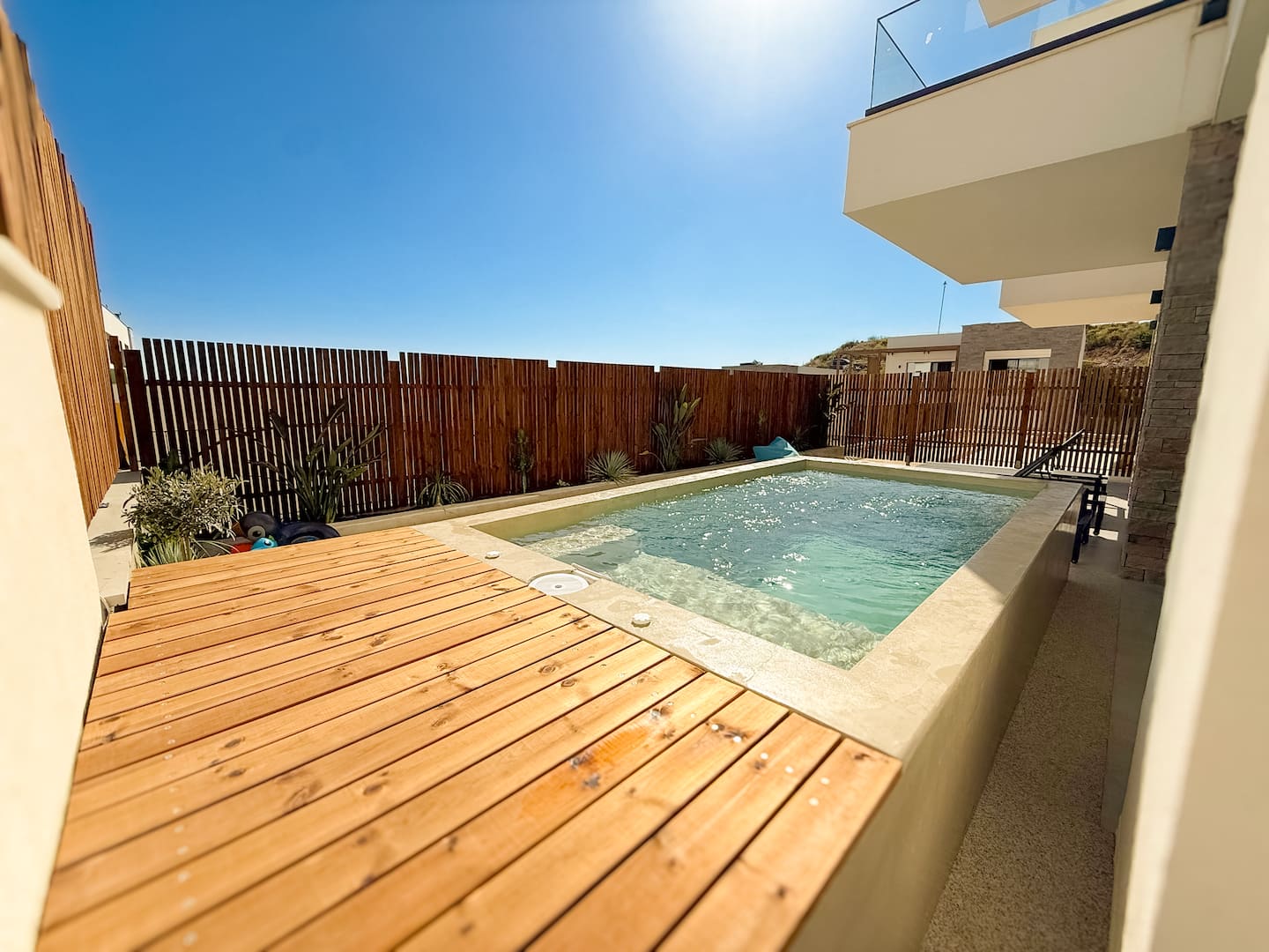 Private plunge pool with timber deck and Ionian Sea view at Villa 4.