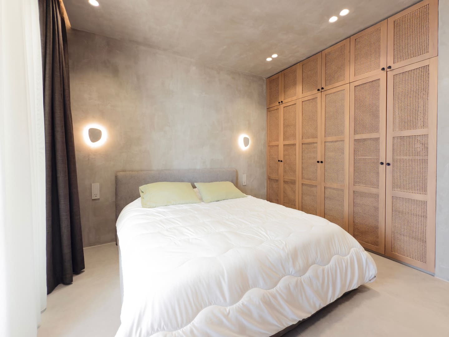Bedroom 1 at Villa 4 — king bed and terrace access.